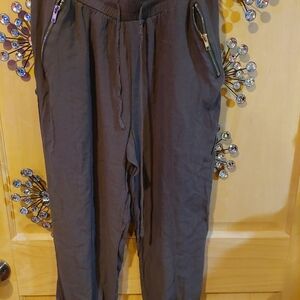 Dark khaki colored Capri Pants with Zipper Pockets and elastic waist and bottom